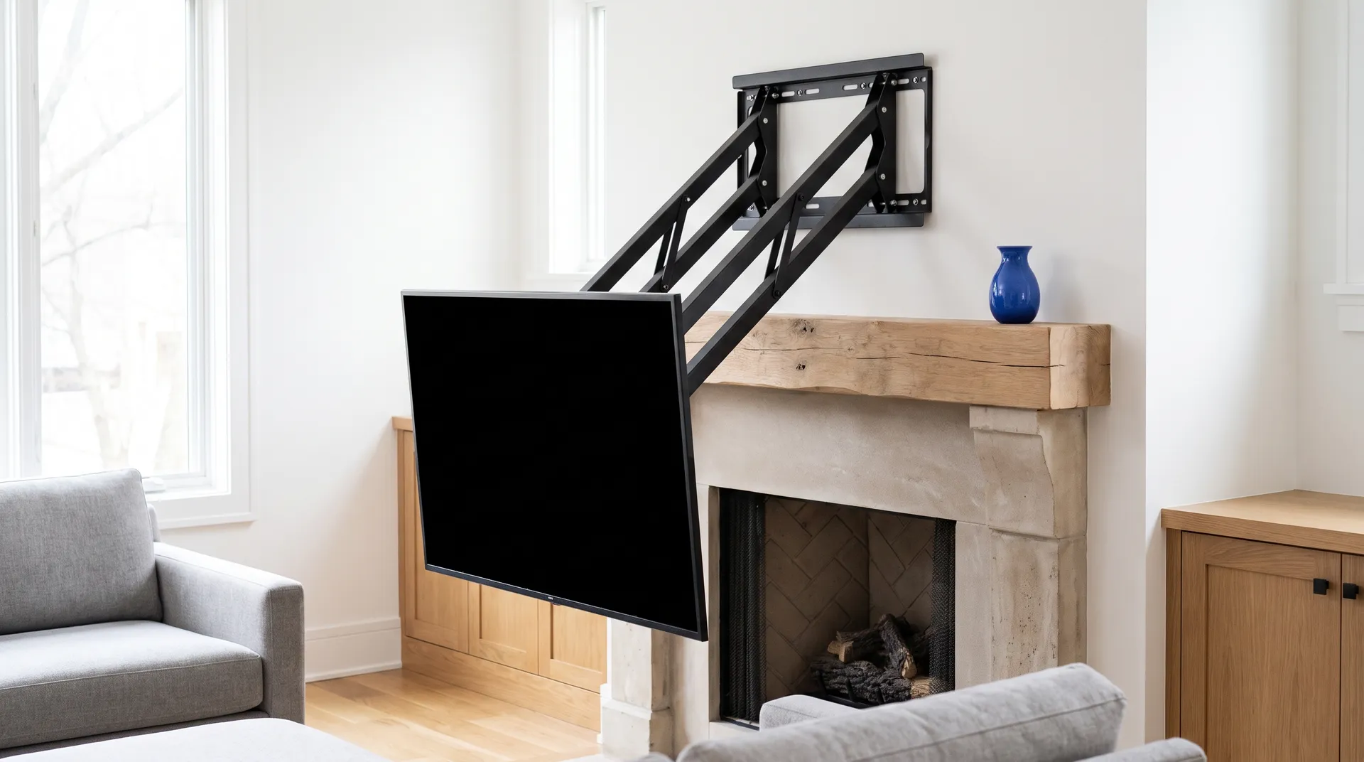TV lowered to seated eye level on a pull-down mantel mount in front of a stone fireplace