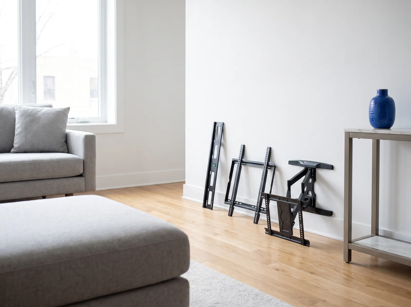 Fixed, tilting and full-motion TV brackets side by side