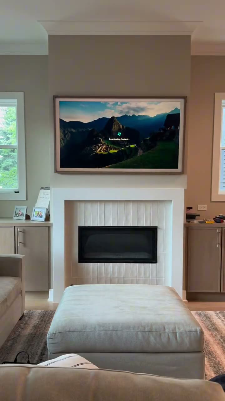 Frame TV installation above a fireplace