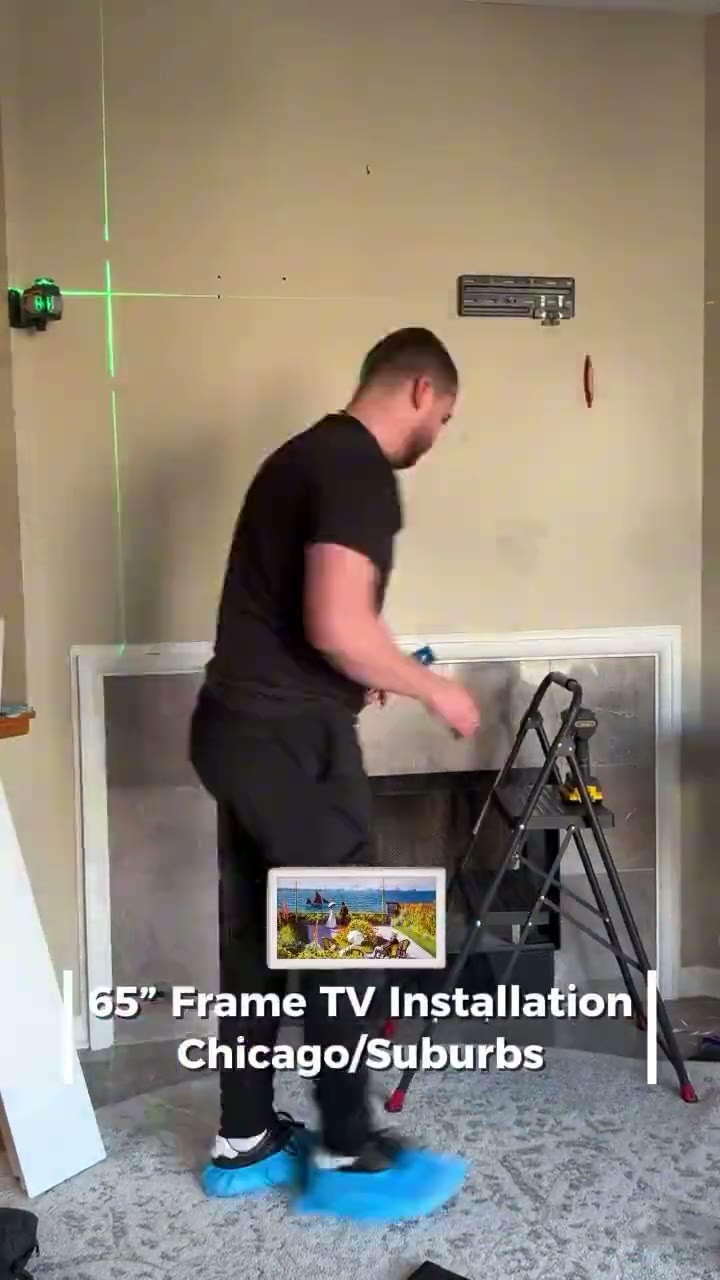 Technician mounting a Samsung Frame TV